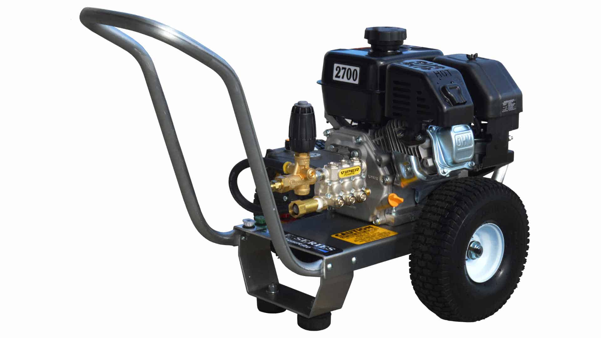 A pressure washer machine with a gasoline engine, metal frame, black handle, and large wheels. The unit is labeled "2700" and features various nozzles and connections.